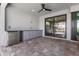 Covered patio area featuring built-in cabinetry, beverage fridge, and convenient sliding door access at 1330 Mineo Dr, Punta Gorda, FL 33950