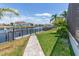 Waterfront property boasts scenic canal views, dock access, and a paved pathway to the water at 1330 Mineo Dr, Punta Gorda, FL 33950