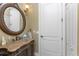 Bathroom showcasing an ornate vanity with vessel sink and decorative mirror at 1367 Grebe Dr, Punta Gorda, FL 33950