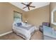 Well-lit bedroom with a comfortable bed and a cozy sitting area, perfect for relaxation at 1367 Grebe Dr, Punta Gorda, FL 33950