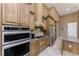 Modern kitchen with stainless steel appliances and beautiful granite countertops at 1367 Grebe Dr, Punta Gorda, FL 33950