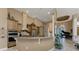 Modern kitchen with granite countertops and pass-through counter into living room at 1367 Grebe Dr, Punta Gorda, FL 33950