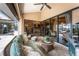Relaxing lanai with comfortable seating, ceiling fan, and seamless access to indoor spaces, perfect for enjoying the outdoors at 1367 Grebe Dr, Punta Gorda, FL 33950