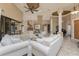 Spacious living room with high ceilings, tile floors, lots of seating, and a view to the outside at 1367 Grebe Dr, Punta Gorda, FL 33950
