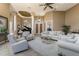 Spacious living room with neutral tones, tile flooring, and modern furnishings at 1367 Grebe Dr, Punta Gorda, FL 33950