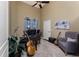 Comfortable home office with a vaulted ceiling, natural light, and ample workspace for productivity at 1367 Grebe Dr, Punta Gorda, FL 33950