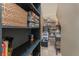 Organized pantry with shelving for food storage and household items, maximizing space and efficiency at 1367 Grebe Dr, Punta Gorda, FL 33950