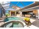 Inviting screened pool area with adjacent seating areas and picturesque views of the waterfront at 1367 Grebe Dr, Punta Gorda, FL 33950