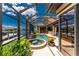 Lovely screened pool with jacuzzi and patio and views of the canal and boat dock at 1367 Grebe Dr, Punta Gorda, FL 33950