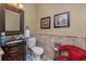 Stylish powder room with decorative mirror, elegant vanity, and tiled accents, adding a touch of luxury to the home at 1367 Grebe Dr, Punta Gorda, FL 33950