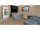 Comfortable home theater featuring reclining seats, large screen, and nautical-themed decor, perfect for movie nights at 1367 Grebe Dr, Punta Gorda, FL 33950