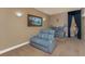 Spacious home theater with plush seating, tiered levels, and ambient lighting for an immersive viewing experience at 1367 Grebe Dr, Punta Gorda, FL 33950