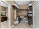Spacious walk-in closet with custom shelving and hanging storage at 1367 Grebe Dr, Punta Gorda, FL 33950