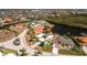 Waterfront home featuring lush landscaping, a canal, and a backyard pool enclosure at 1374 Grebe Dr, Punta Gorda, FL 33950