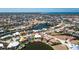 Aerial view of home in a beautiful waterfront community with lush landscaping and canals at 1374 Grebe Dr, Punta Gorda, FL 33950