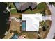Aerial view of home's lot and floorplan featuring a private pool and dock along a canal at 1374 Grebe Dr, Punta Gorda, FL 33950