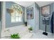 Elegant bathroom showcasing a soaking tub, decorative accents, and a large window, offering a tranquil retreat at 1374 Grebe Dr, Punta Gorda, FL 33950