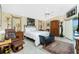 Cozy bedroom featuring unique furnishings, decorative lighting and light-colored walls at 1374 Grebe Dr, Punta Gorda, FL 33950