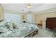Serene bedroom with neutral tones, offering a relaxing space with ample closet storage and natural light at 1374 Grebe Dr, Punta Gorda, FL 33950
