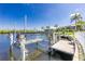 View of the dock, boat lift, and canal at 1374 Grebe Dr, Punta Gorda, FL 33950