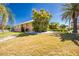 Well-maintained front yard with lush tropical landscaping and charming curb appeal at 1374 Grebe Dr, Punta Gorda, FL 33950