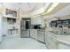 Open kitchen features stainless steel appliances, granite countertops, and modern fixtures at 1374 Grebe Dr, Punta Gorda, FL 33950