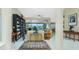 Open-concept living room with high ceilings, tile flooring, and sliding doors to the pool area at 1374 Grebe Dr, Punta Gorda, FL 33950