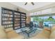 Comfortable living room featuring neutral tones, tile flooring and sliding glass doors to the outdoor area at 1374 Grebe Dr, Punta Gorda, FL 33950