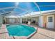 Stunning screened-in pool with outdoor shower and ample patio space for entertaining at 1374 Grebe Dr, Punta Gorda, FL 33950