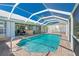 Inviting screened-in pool with access to outdoor living spaces at 1374 Grebe Dr, Punta Gorda, FL 33950