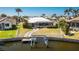 Beautiful waterfront home with a private dock, screened-in pool, and well-maintained lawn at 1374 Grebe Dr, Punta Gorda, FL 33950