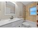 Bathroom featuring tub and shower, white vanity, and framed mirror with lighting at 1510 Orlando Blvd, Port Charlotte, FL 33952