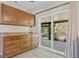 Kitchen area with ample cabinet storage and sliding doors that lead to lanai at 1510 Orlando Blvd, Port Charlotte, FL 33952