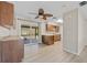 Kitchen and dining area featuring wooden cabinets and a sliding glass door leading outside at 1510 Orlando Blvd, Port Charlotte, FL 33952