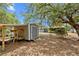 View of a shed in the backyard on a sunny day at 1510 Orlando Blvd, Port Charlotte, FL 33952