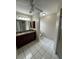 Bathroom with vanity, tiled floor and shower, designed for comfort and convenience at 16072 Galiano Ct, Punta Gorda, FL 33955