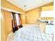 Dining area with white-tiled floor, and natural lighting, creating a pleasant dining experience at 16072 Galiano Ct, Punta Gorda, FL 33955