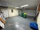 Spacious garage with ample storage space, lighting, and door at 16072 Galiano Ct, Punta Gorda, FL 33955