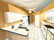 Practical kitchen features white cabinets and appliances, providing a clean space at 16072 Galiano Ct, Punta Gorda, FL 33955