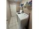 Functional laundry room with appliances, a sink, and tiled flooring at 16072 Galiano Ct, Punta Gorda, FL 33955