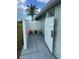 Outdoor enclosed storage area with white fence, bags of garden soil, and concrete patio at 16072 Galiano Ct, Punta Gorda, FL 33955