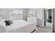 Bedroom with a view of the lake, bright white furniture, neutral walls and carpet flooring at 16079 Bandermill Dr, Port Charlotte, FL 33953