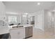 Stylish kitchen with white cabinets, stainless steel appliances, and an integrated dishwasher at 16079 Bandermill Dr, Port Charlotte, FL 33953