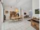 The dining room features elegant wooden furniture, a chandelier, and tile flooring, creating a sophisticated dining atmosphere at 17210 Chase Ave, Port Charlotte, FL 33948