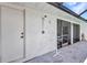 Exterior of property with outdoor shower, door, and screened windows with natural light at 17210 Chase Ave, Port Charlotte, FL 33948