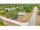 A charming single-Gathering home showing the landscaping and circular driveway at 17210 Chase Ave, Port Charlotte, FL 33948