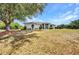 Beautiful front exterior of a single-Gathering home featuring manicured lawn and inviting entryway at 17210 Chase Ave, Port Charlotte, FL 33948