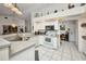 Kitchen featuring white cabinets, ample counter space, and stainless steel appliances at 17210 Chase Ave, Port Charlotte, FL 33948