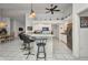 Bright kitchen with breakfast bar, stainless appliances, and decorative shelving at 17210 Chase Ave, Port Charlotte, FL 33948
