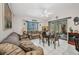 Inviting living room boasts bright natural light, comfortable seating and sliding door access at 17210 Chase Ave, Port Charlotte, FL 33948